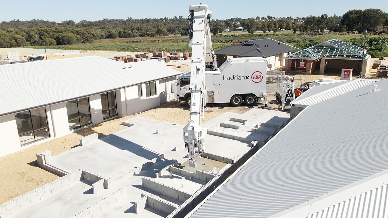 Bricklaying robot, Hadrian X, autonomously building the walls of a house.