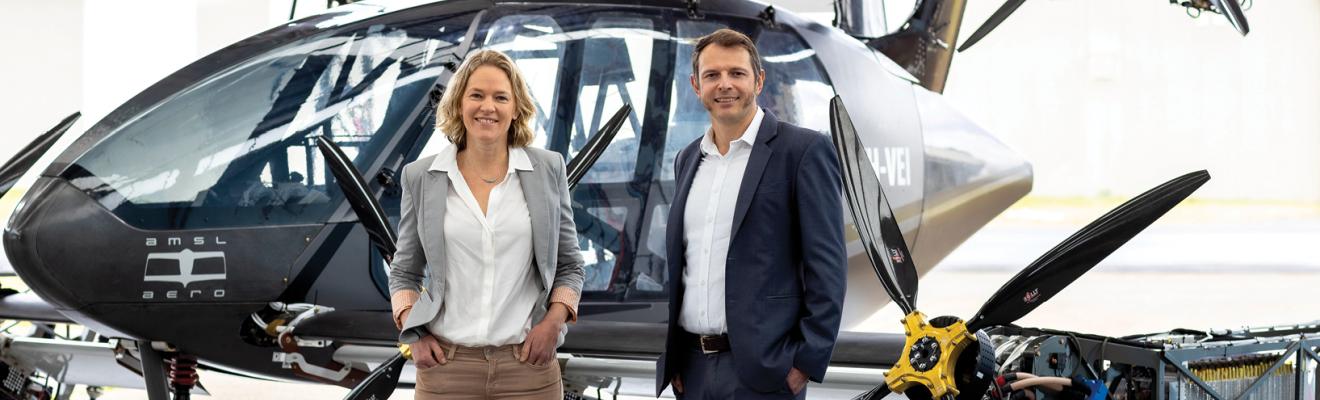 AMSL founders Siobhan Lyndon (L) and Andrew Moore (R) in front of the Vertiia prototype aircraft