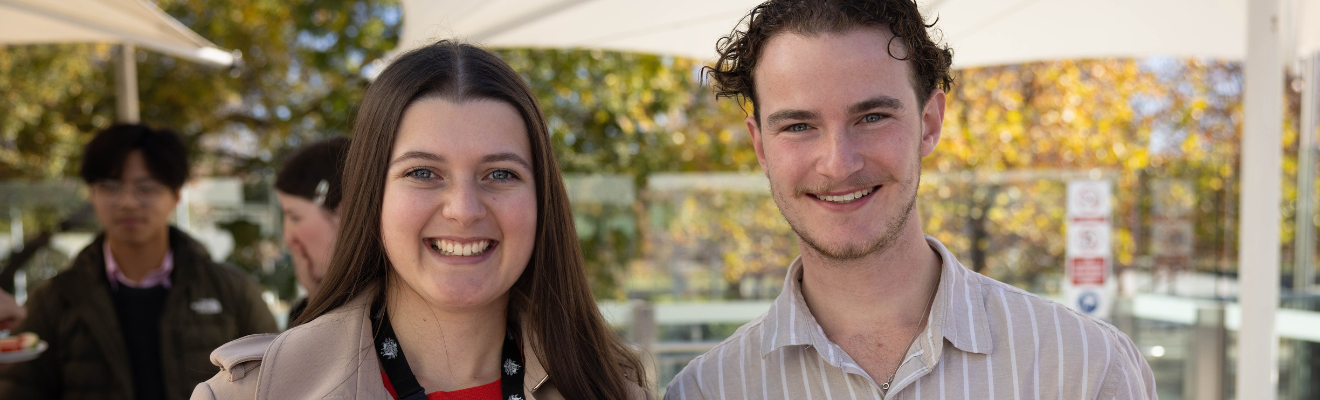 Young man and woman at an outdoor event