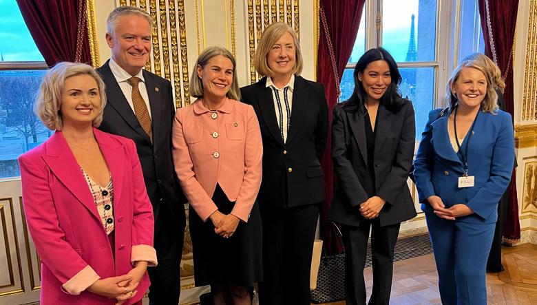 Group photo of the Australian delegation and OECD Secretary General at the AI Action Summit in Paris, France  