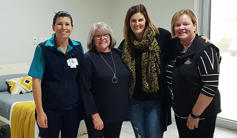 Sarah Modystach, Sheree Clements, Toni Scott and Kylie Hass stand in one room at the Kimba Palliative Care unit.