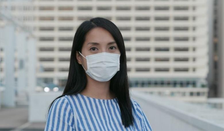 Woman wearing a surgical face mask