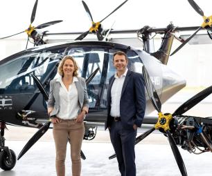 AMSL founders Siobhan Lyndon (L) and Andrew Moore (R) in front of the Vertiia prototype aircraft