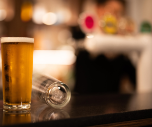 A glass of beer at a bar